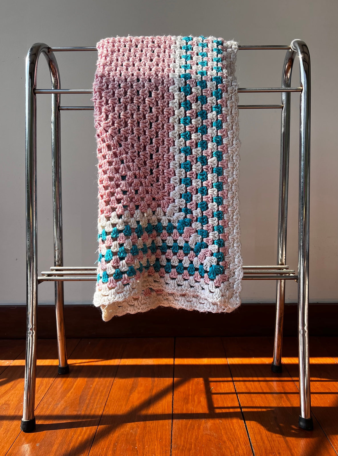 vintage pink and blue crocheted baby blanket